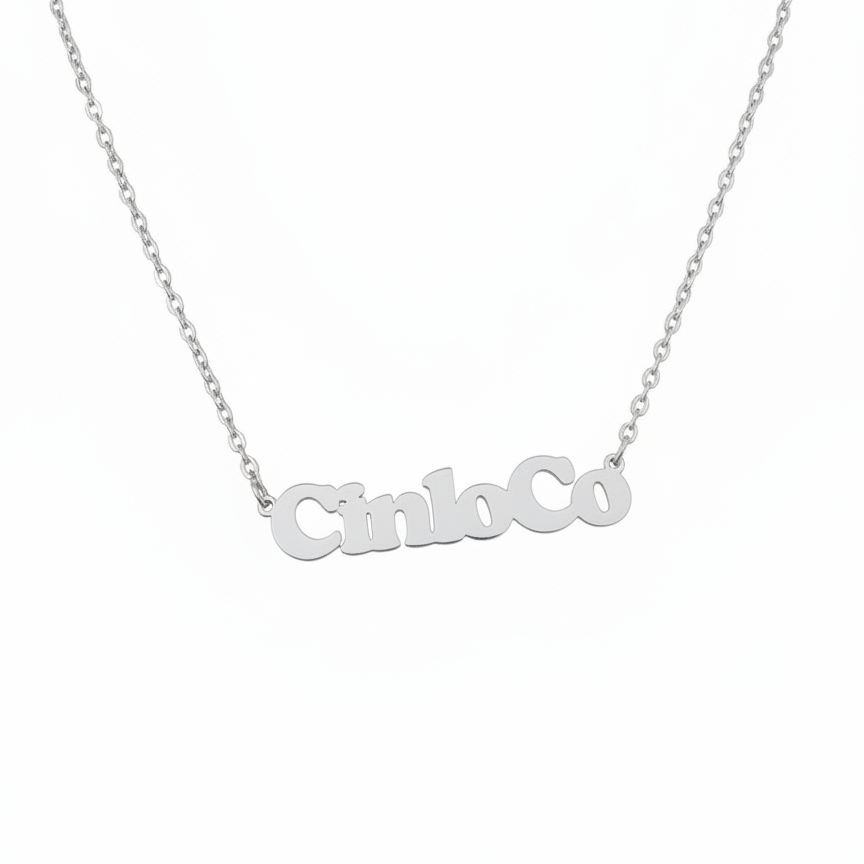 Silver necklace with 'CincoCo' pendant on a white background