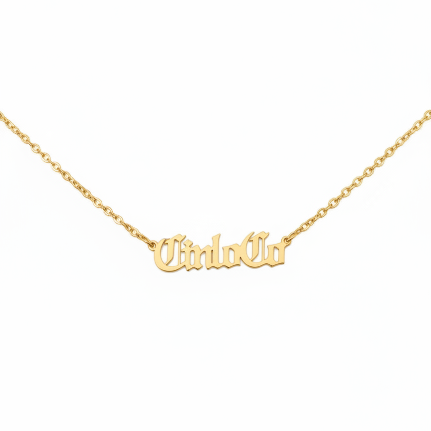 Gold necklace with 'CiriloCo' pendant on a white background