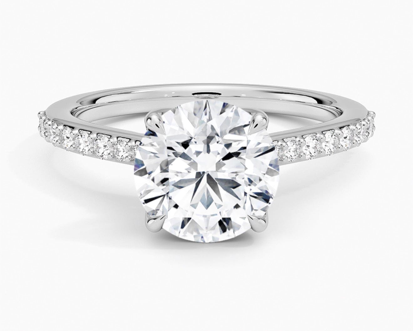 Diamond ring with a white gemstone on a white background