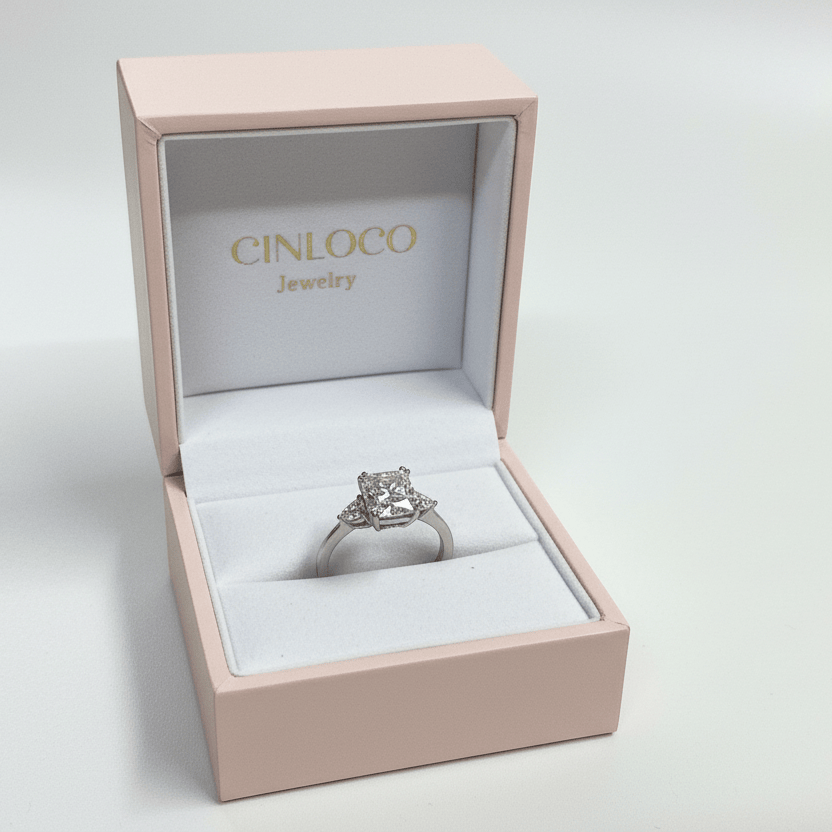 Silver ring in a pink jewelry box with 'Cinloco' branding on a light gray background