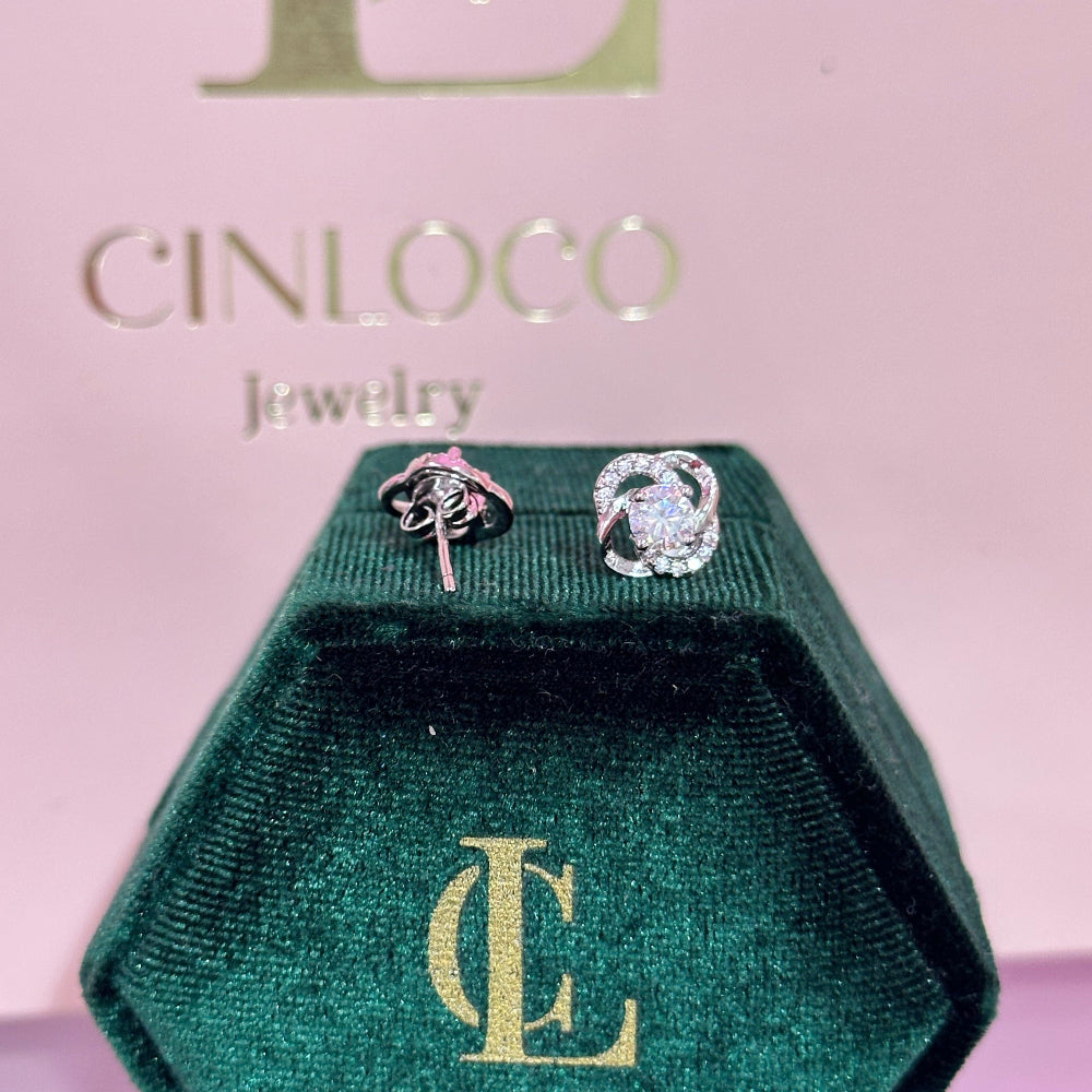 Cinloco jewelry box with earrings on a pink background