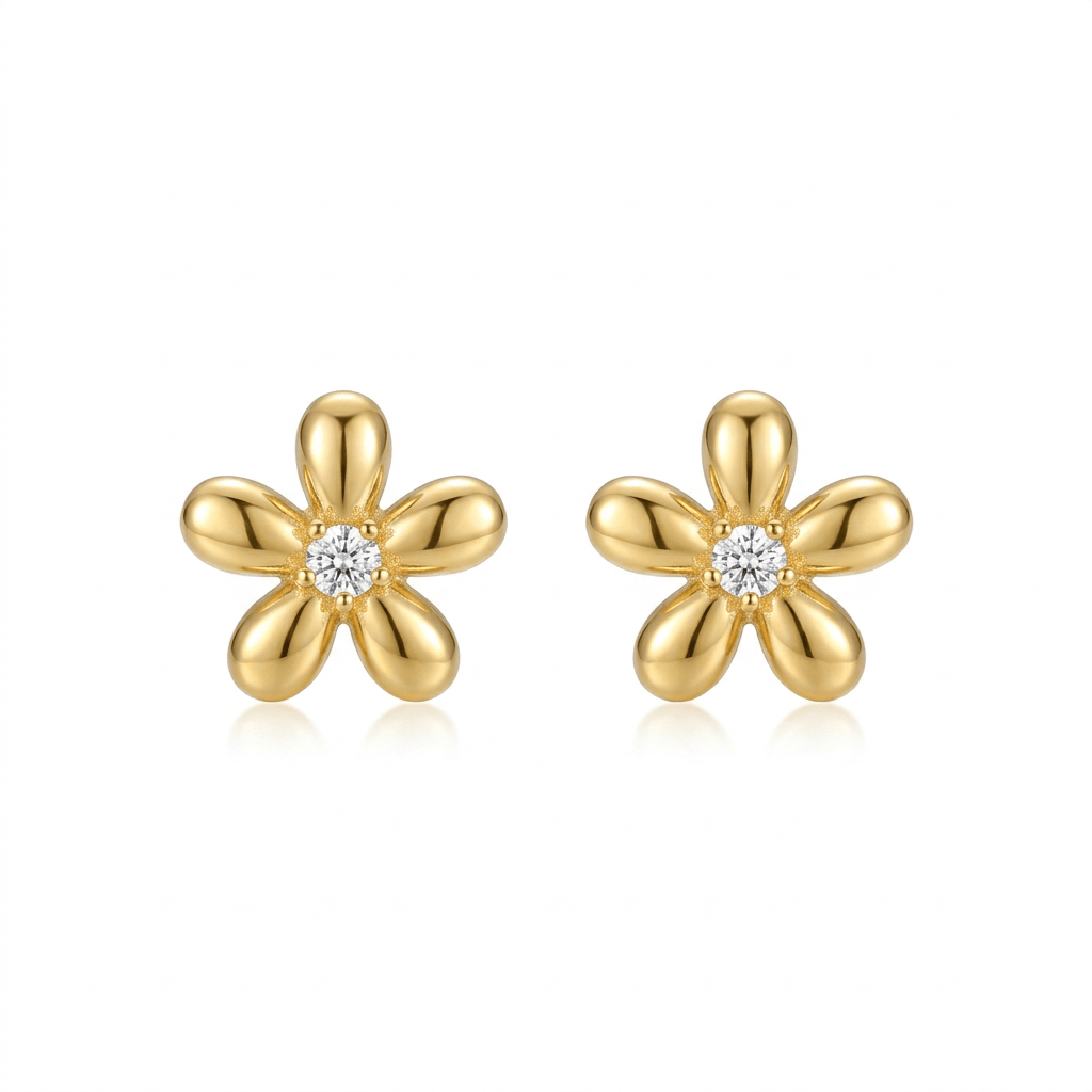 Gold five-petal flower stud earrings with clear center stones on a white background