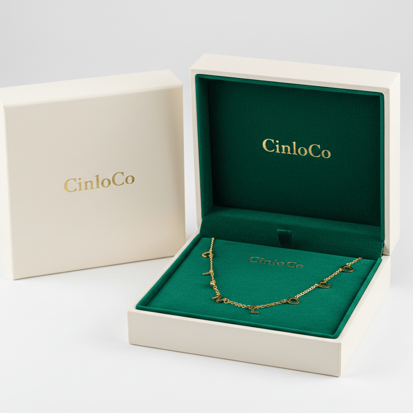Gold necklace in a CinloCo jewelry box on a white background