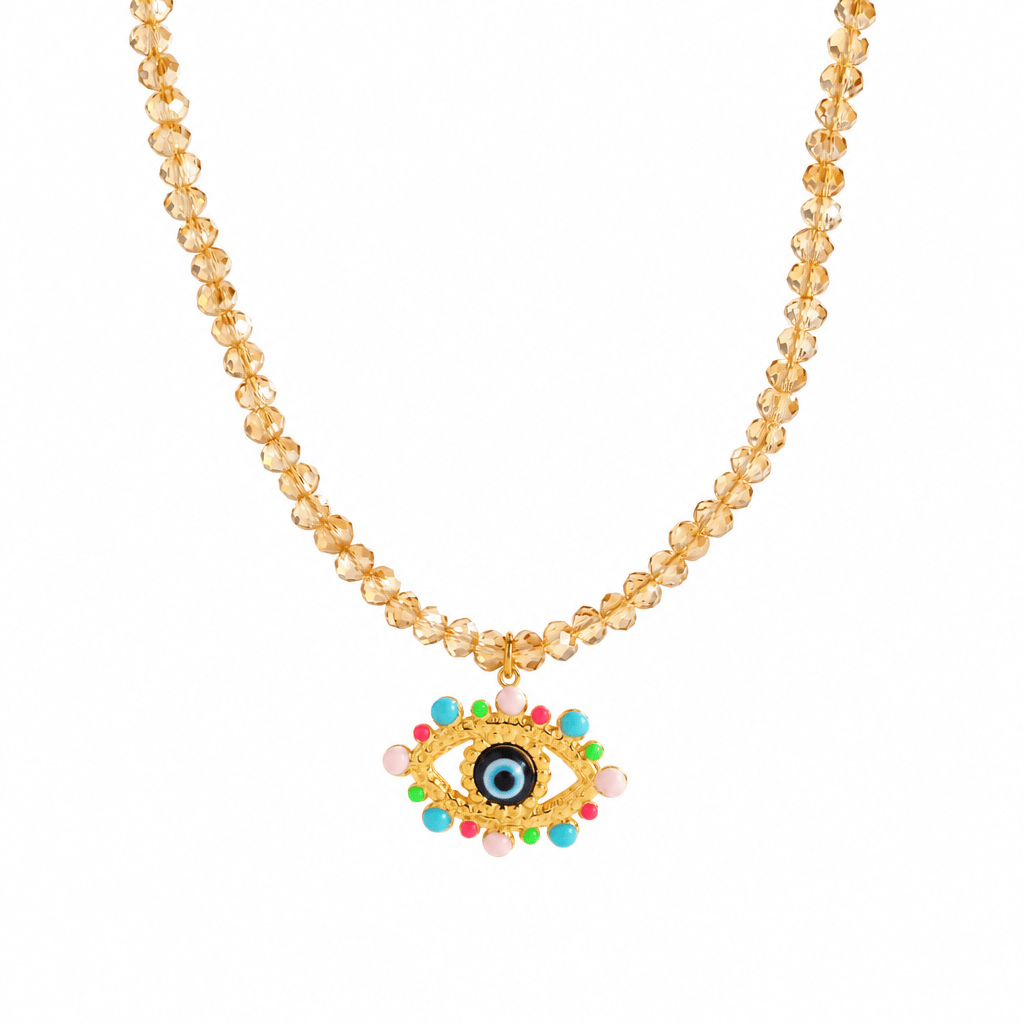 A gold-tone evil eye beaded necklace displayed inside a pink jewelry box with the brand name 'Clinoco' printed on the inside lid.