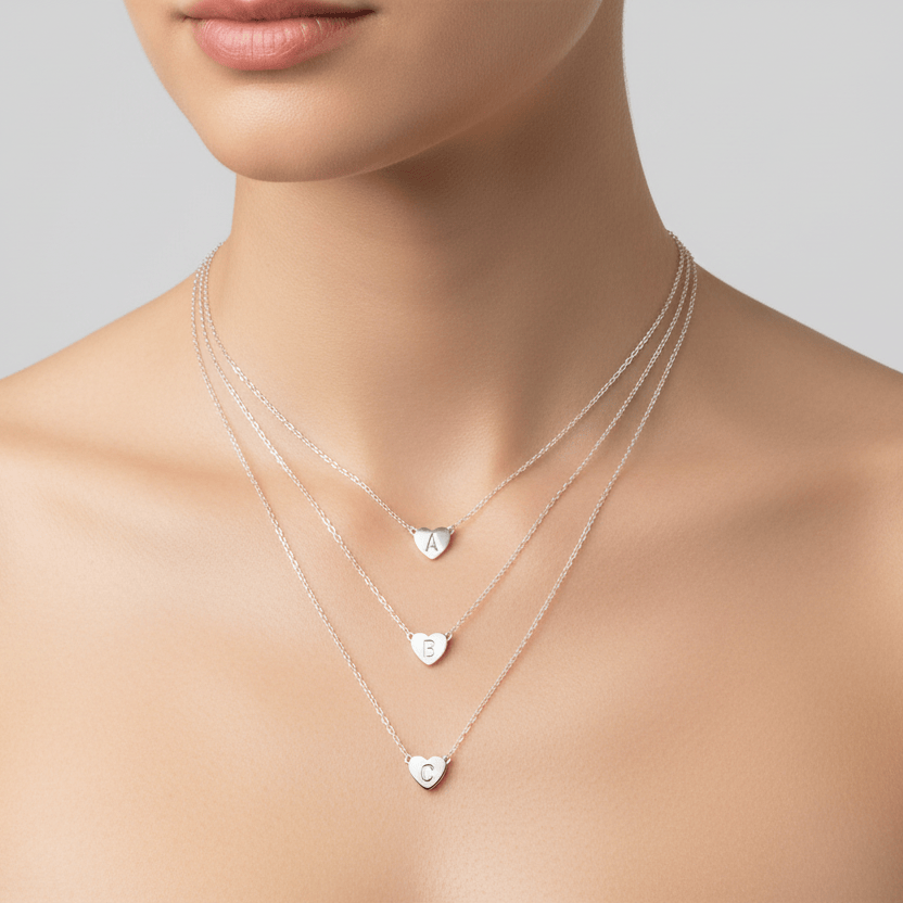 Silver heart initial necklaces