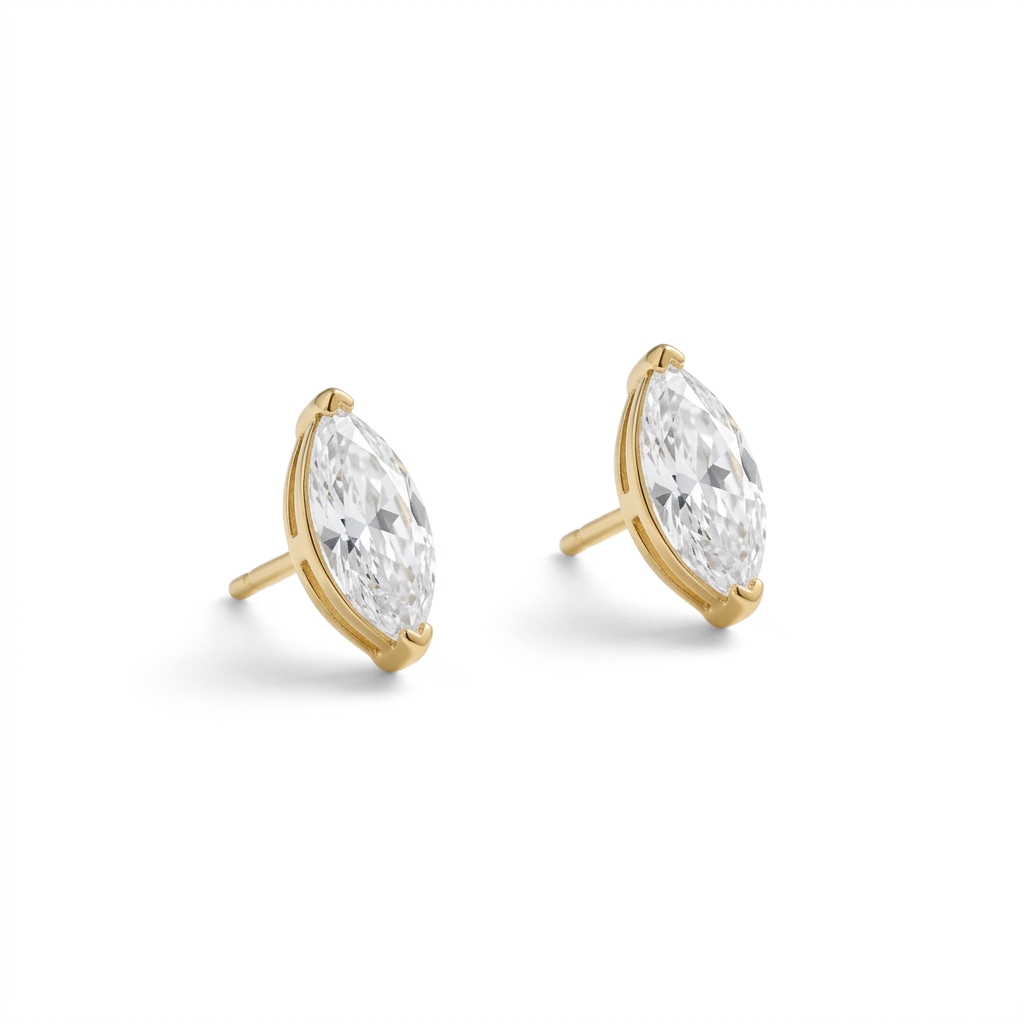 Clear marquise-shaped stud earrings in gold settings on a white background