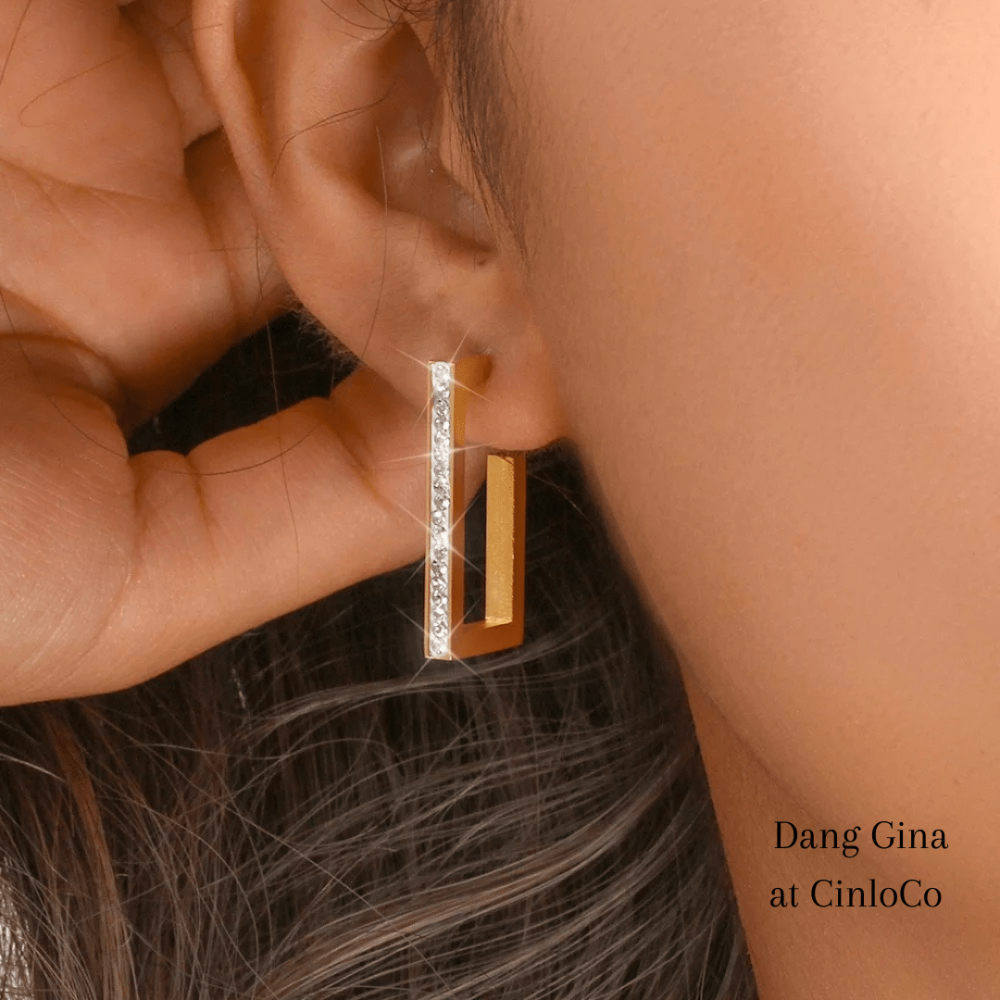 Gold rectangular hoop earrings with white rhinestones