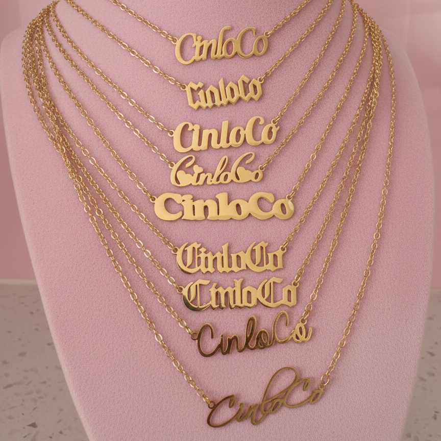 Gold necklaces with customizable name plate necklace branding on a mannequin bust.