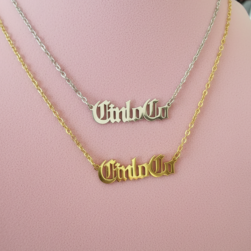 Two necklaces with CUSTOM NAME PLATE pendants on a mannequin.