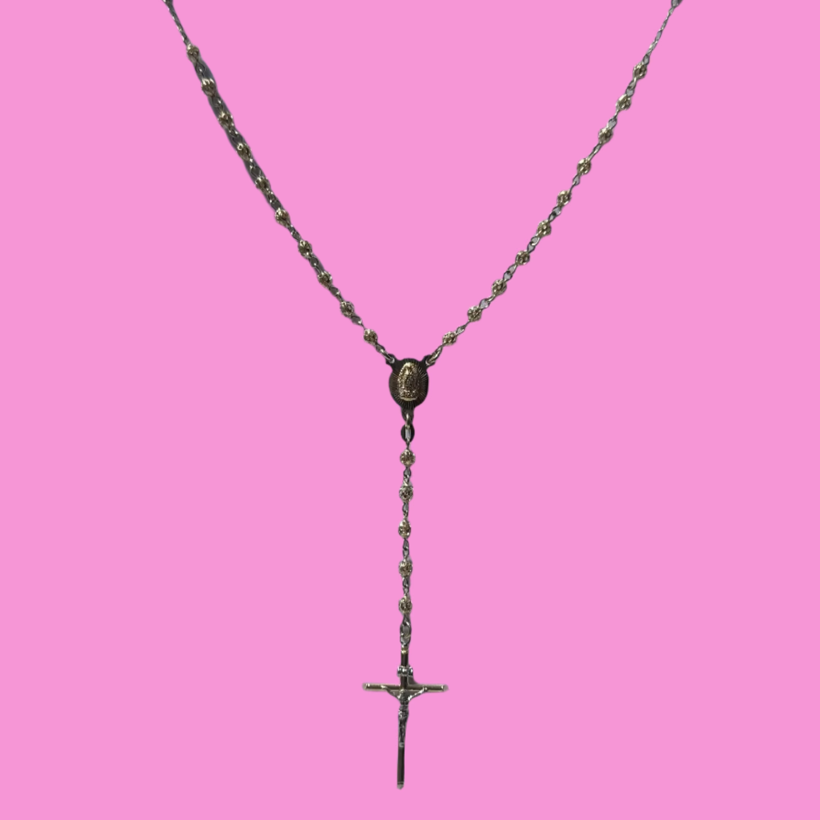 Solid Gold rosary necklace on a pink background