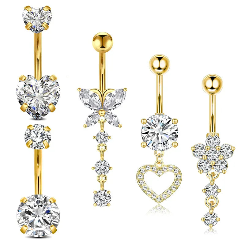 Five gold-plated belly button rings with clear gemstones in heart, butterfly, and flower motifs, displayed on a clean white background.