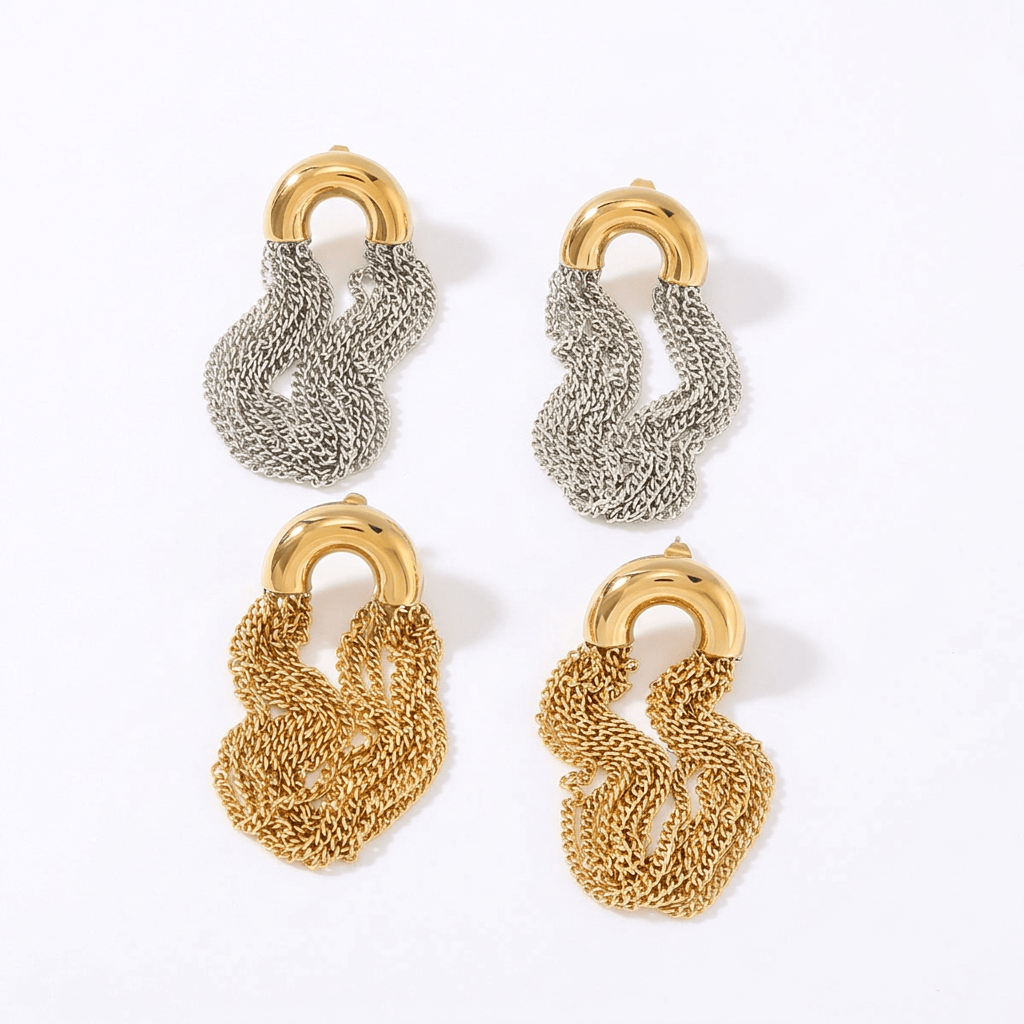 Gold and silver dangling chain earrings on a white background