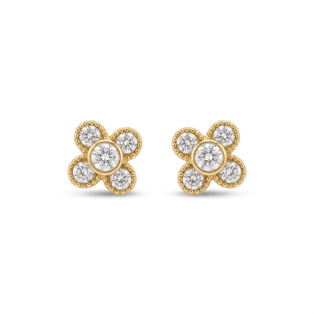 Gold clover stud earrings with clear round stones on a white background