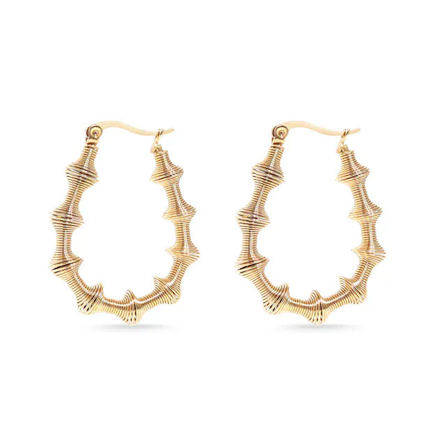Gold hoop earrings on a white background