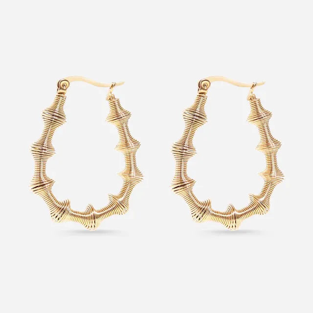 Gold hoop earrings on a white background