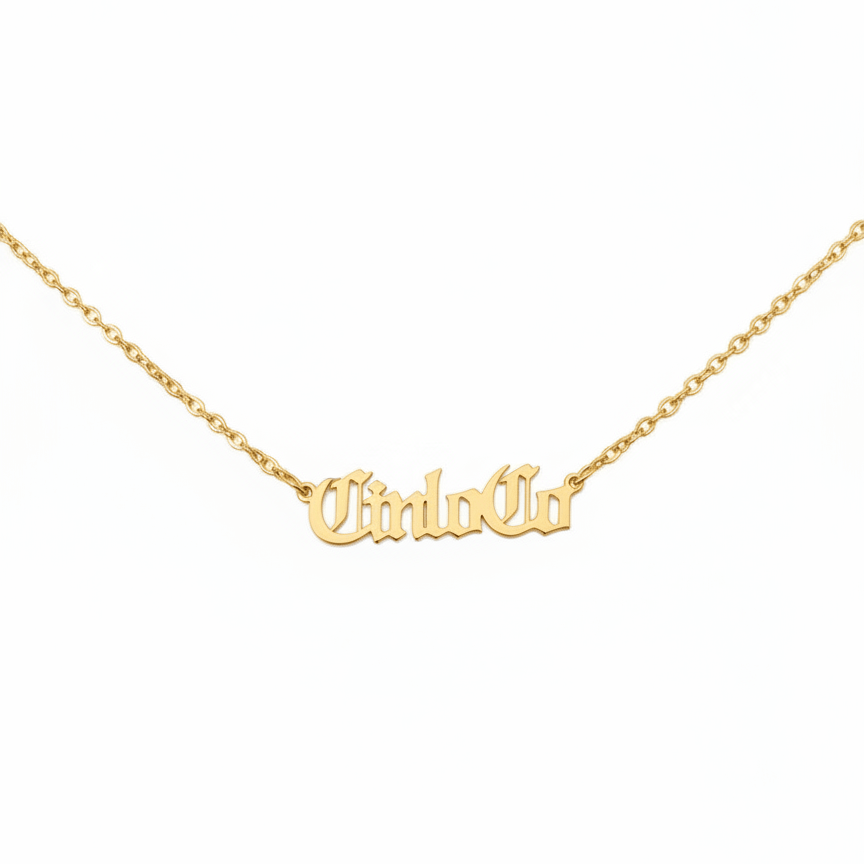 Gold necklace with 'CiriloCo' pendant on a white background