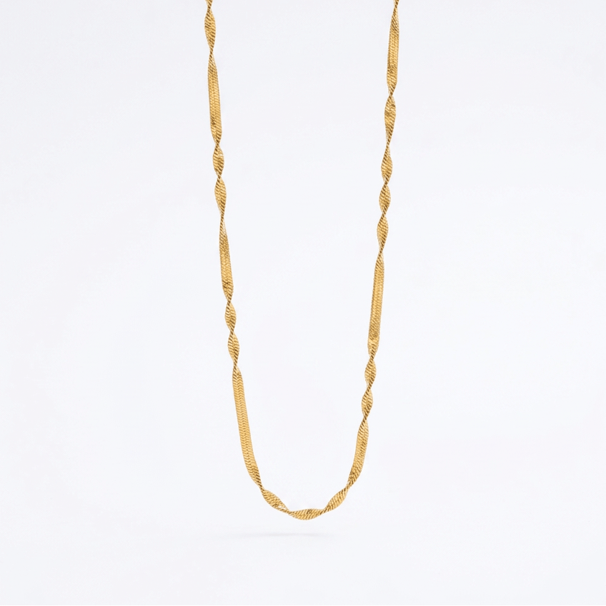 A gold-toned chain necklace with a textured twisted link design and an extender chain with clasp, photographed on a clean white background.