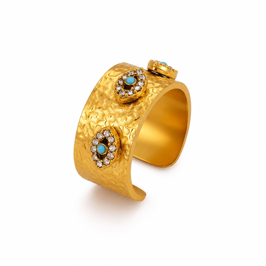 Gold-tone textured cuff bracelet with two oval turquoise and crystal accents, shown on a white background with dimension arrows and text indicating 10mm and 17mm measurements.