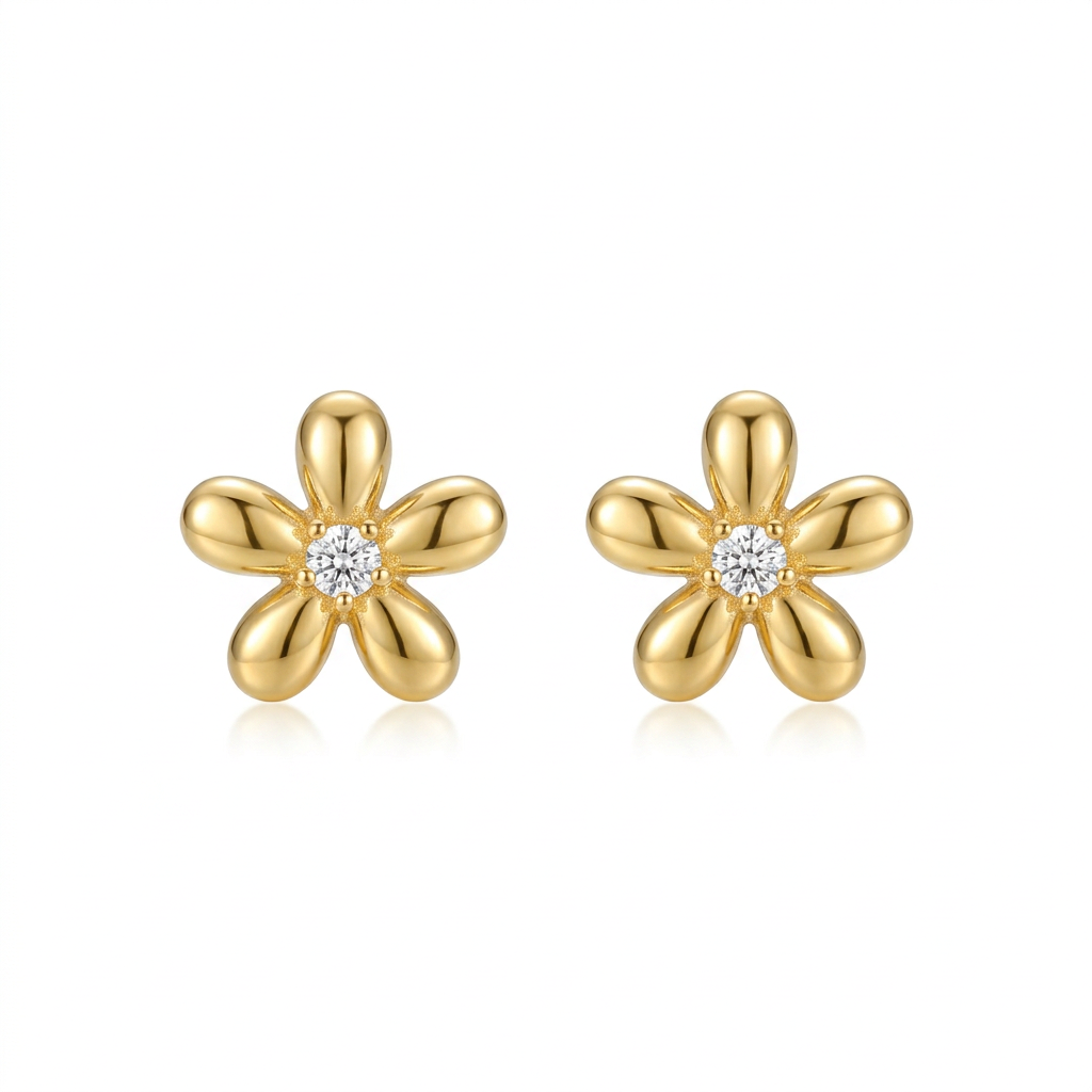 Gold five-petal flower stud earrings with clear center stones on a white background