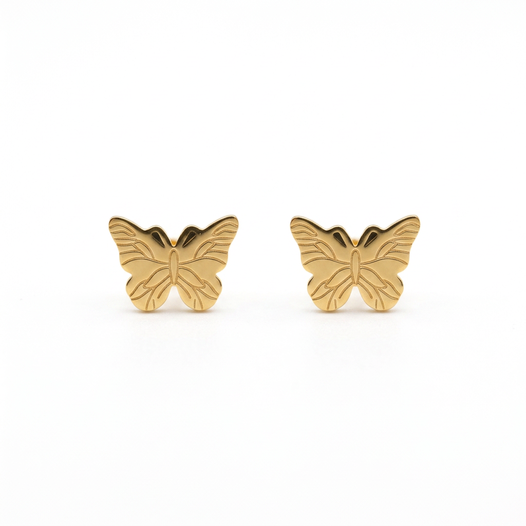 Gold butterfly stud earrings with engraved wing details on a white background