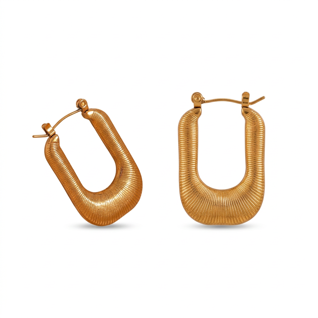 Gold ribbed U-shaped hoop earrings on a white background