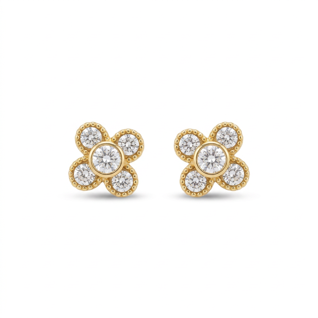 Gold clover stud earrings with clear round stones on a white background